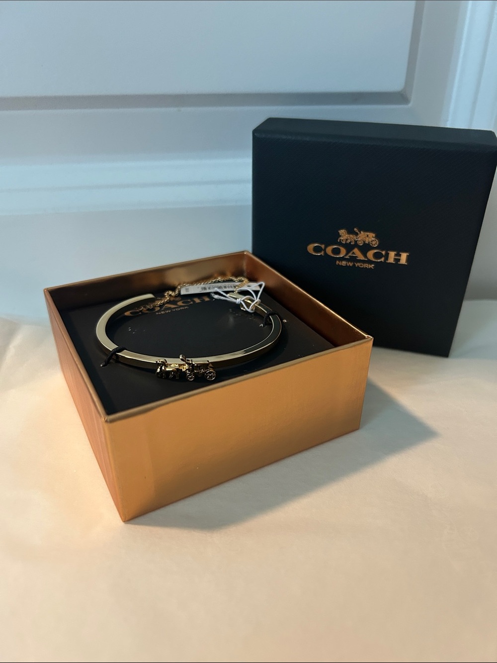 Coach Gold-Tone Slim Hinged Bangle with Charm Accents